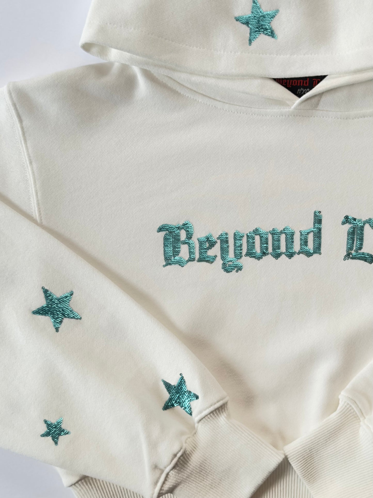 White Crop Hoodie w/ Coastal Blue Sequins. True to Size. Limited Edition!