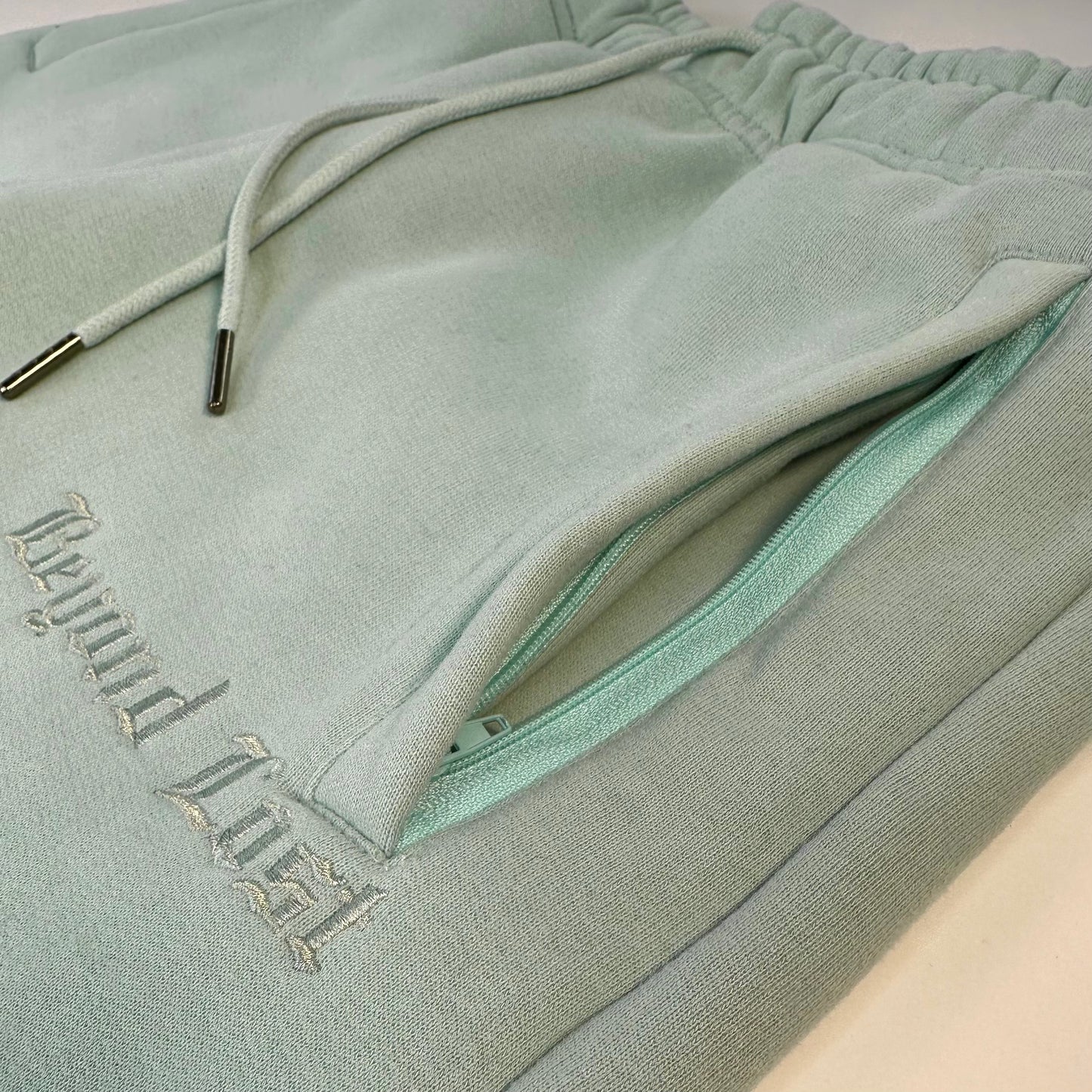 Blue Ocean Mist Sweatpants: Blue Monochrome Embroidery   3 Zip pockets
