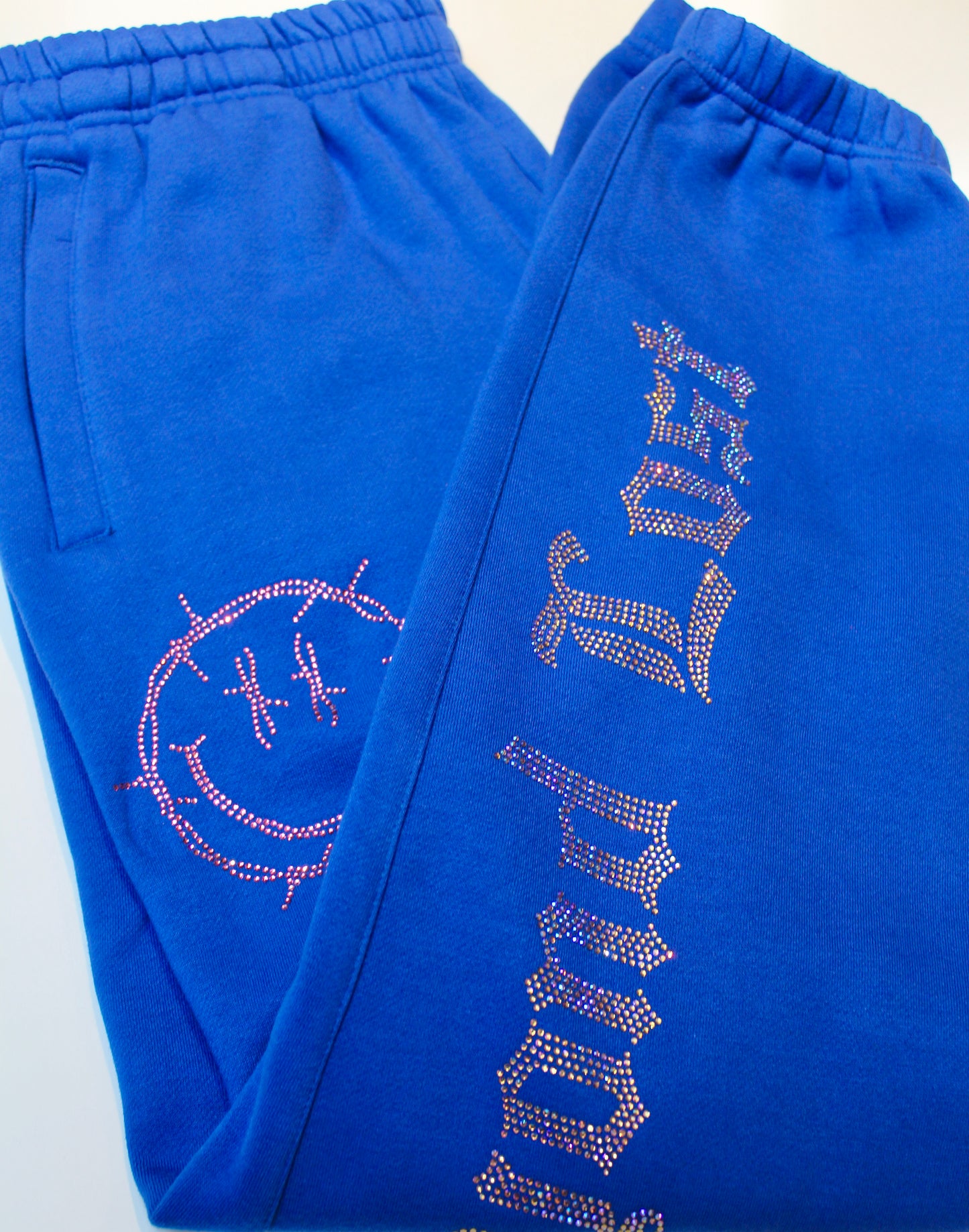 Royal Blue Rhinestone Sweats: Barbed Wire Smiley Face – Beyond Lost NYC